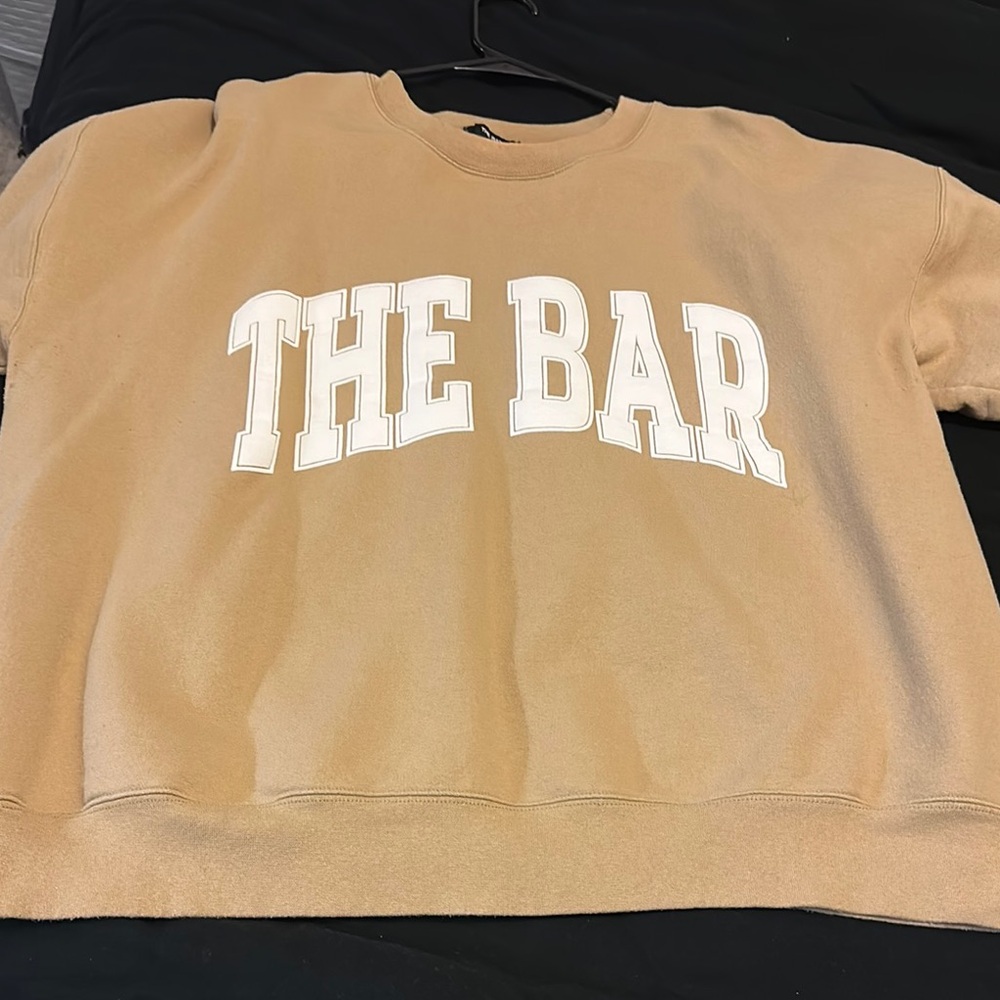 Tan Sweatshirt with White 'THE BAR' Print
